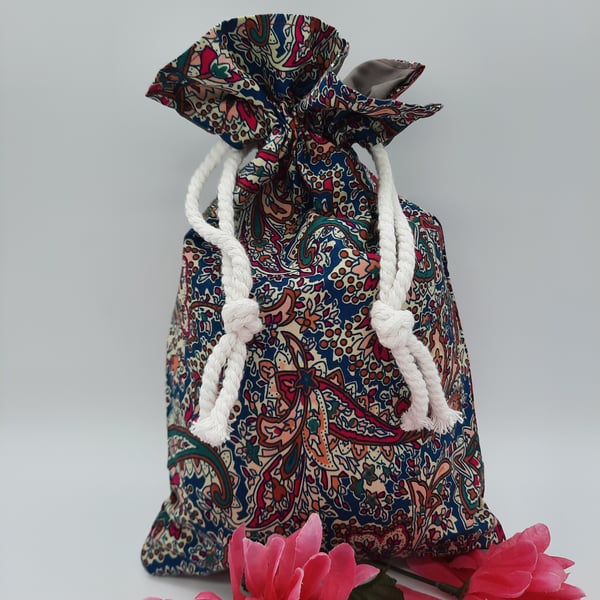 Wash bag in teal and cherry pattern fabric. Sale