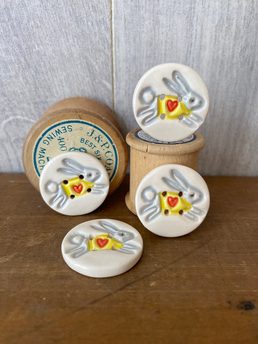 Set of four ceramic leaping bunny buttons