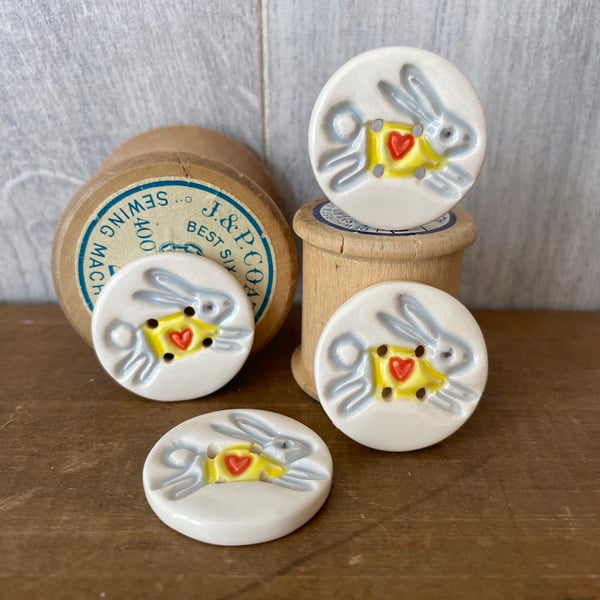 Set of four ceramic leaping bunny buttons