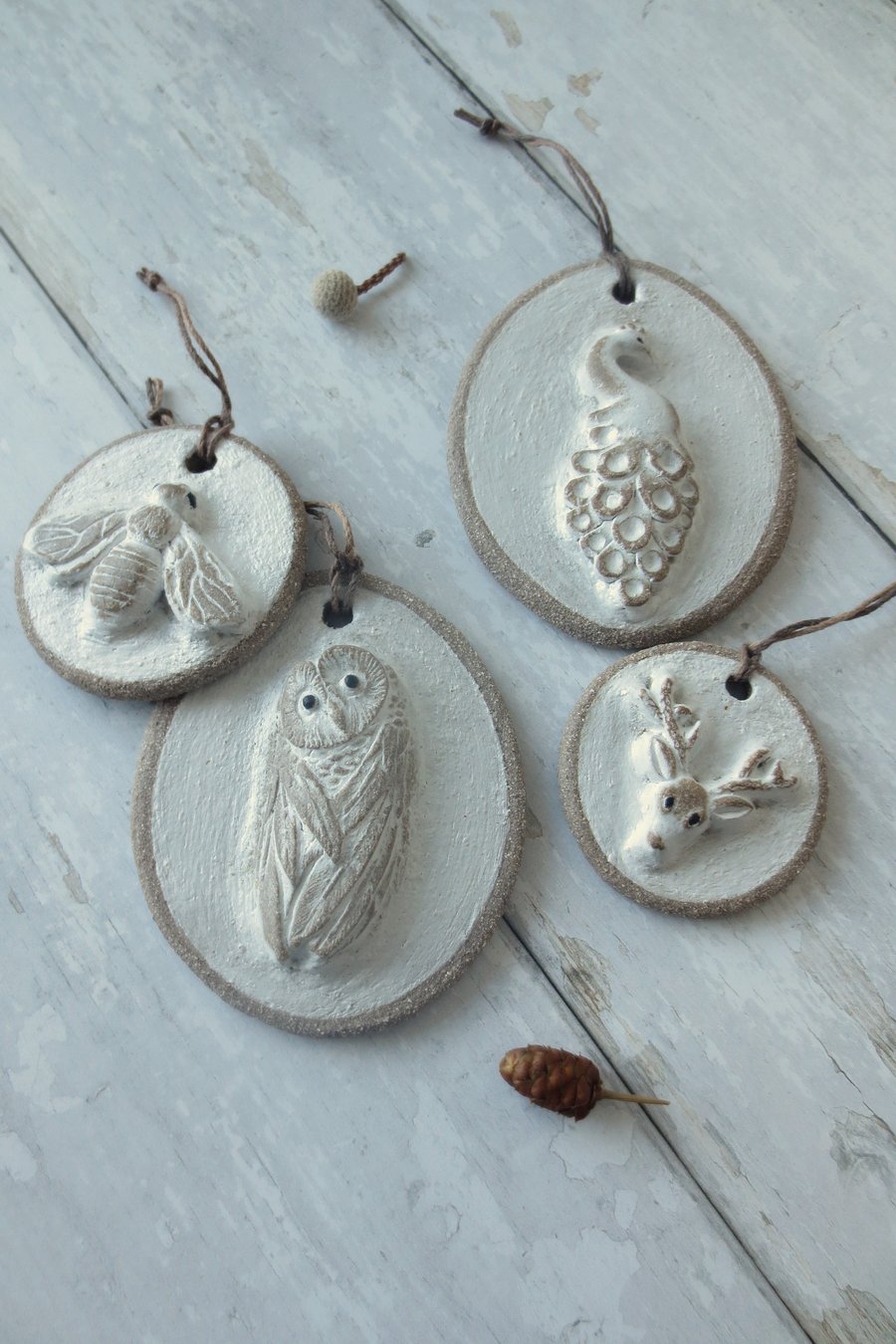 Hand-built stoneware small animal wall plaque ornament in white