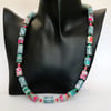Multicoloured pastel and grey paper beaded necklace with flower designs