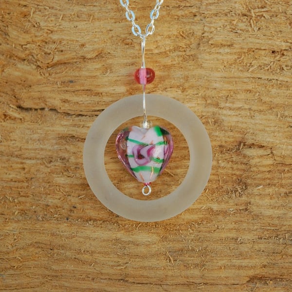 White glass ring pendant with pink rose