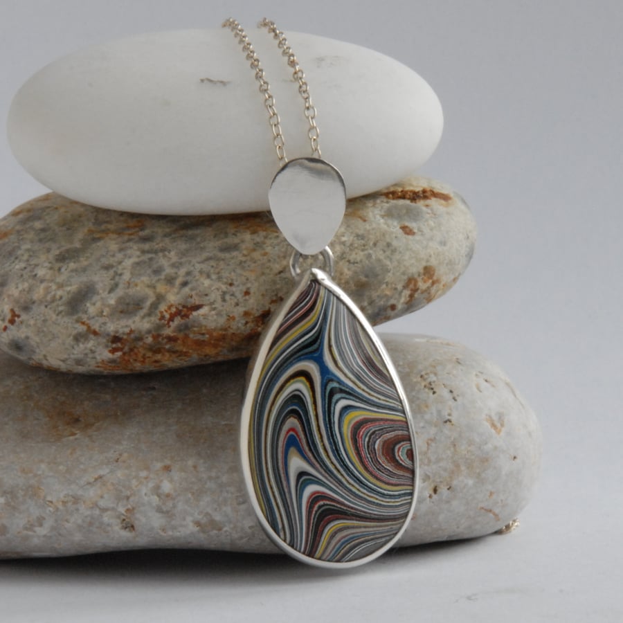 Sterling silver and swirly blue and yellow fordite pear shaped pendant