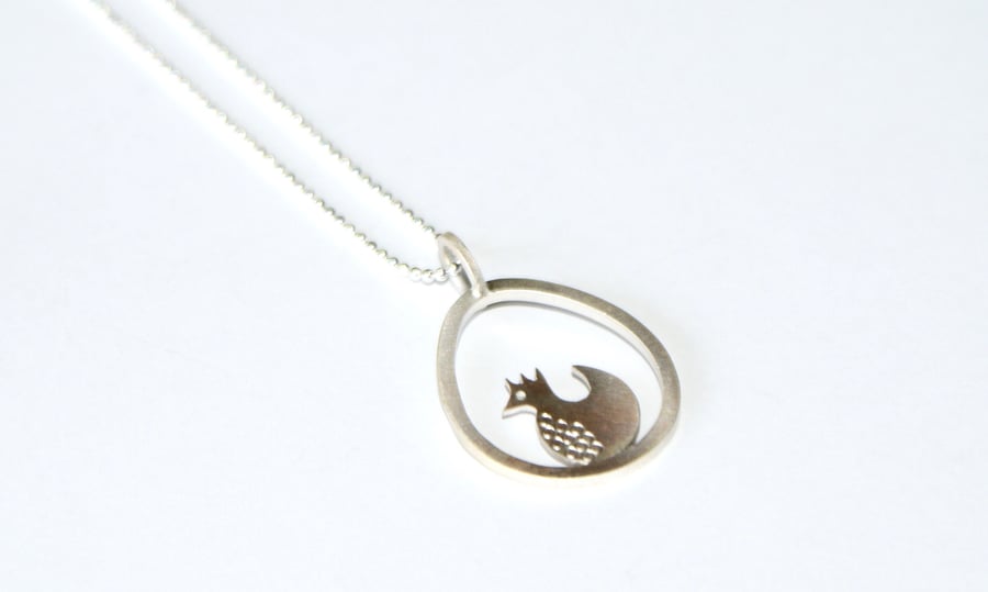 Silver chicken and egg necklace
