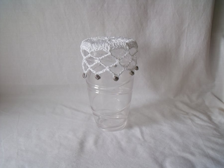 vintage style crocheted beaded doily jug cover to repel bugs when outdoors 
