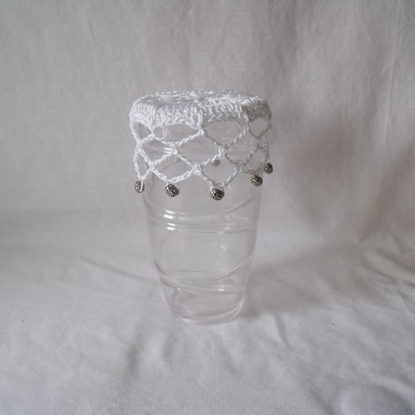 vintage style crocheted beaded doily jug cover to repel bugs when outdoors 