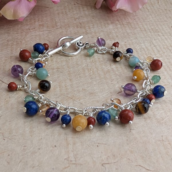 Chakra gemstone charm style bracelet with toggle clasp 