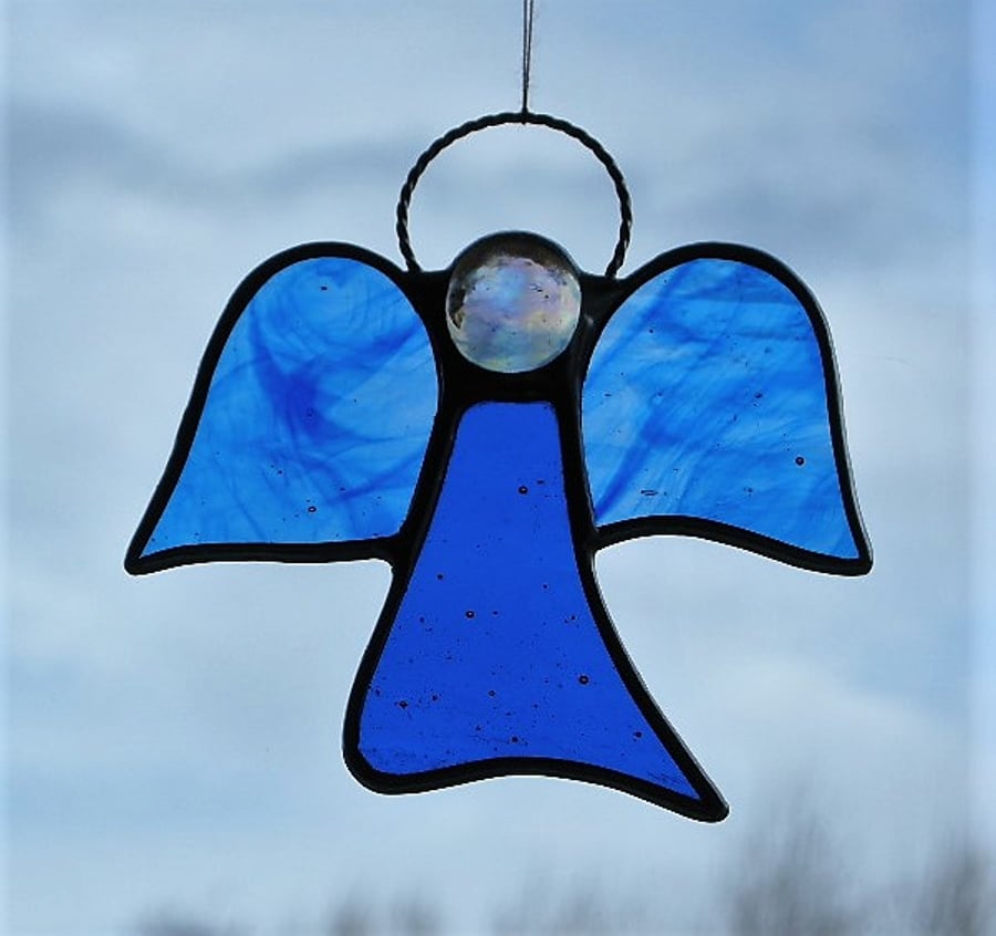 Stained glass (Angel) abstract in blue and blue streaky textured glass