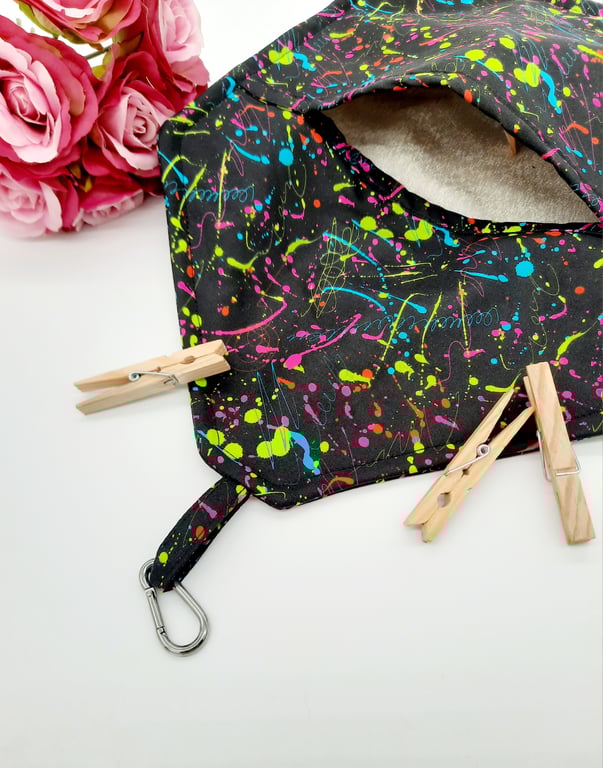 Black clip on peg bag with neon pattern. 