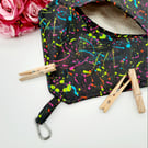 Black clip on peg bag with neon pattern. 