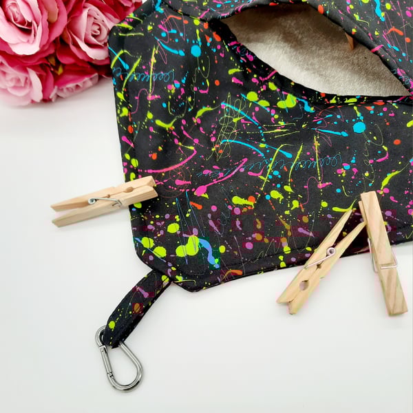 Black clip on peg bag with neon pattern. 