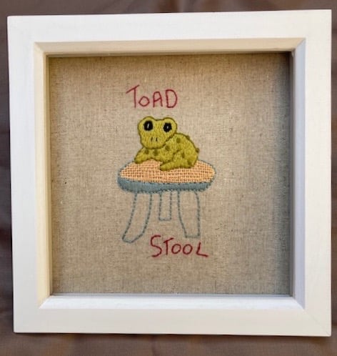 Framed "Toadstool" hand embroidered picture.