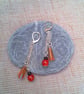 Earrings with Orange Artemis Beads Red and Black Beads on Long Chains - Image 1