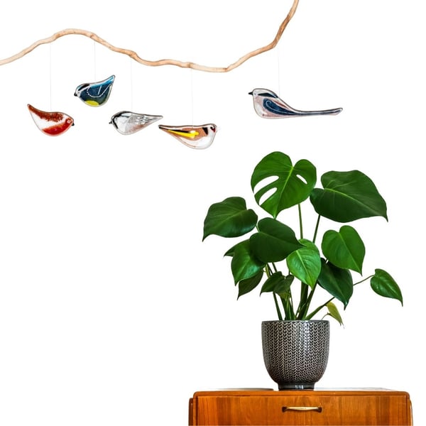 A gift set of fused glass birds to hang in your home