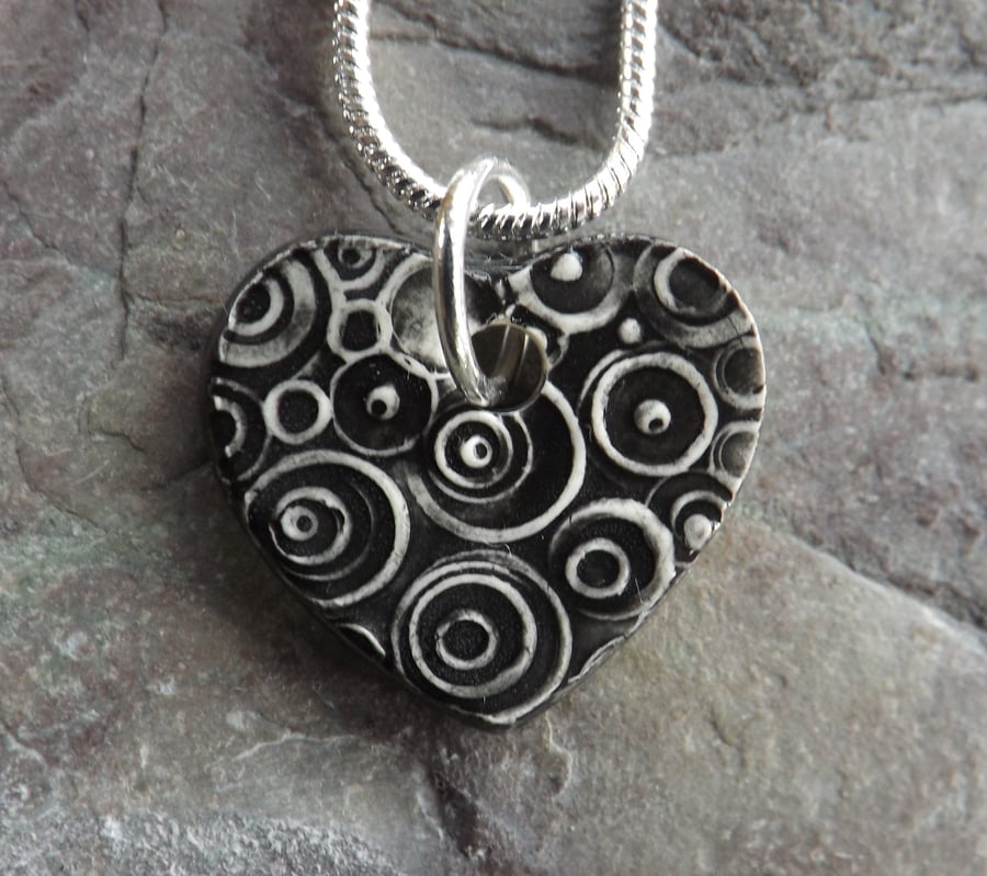 Heart shaped ceramic pendant in black white and grey 