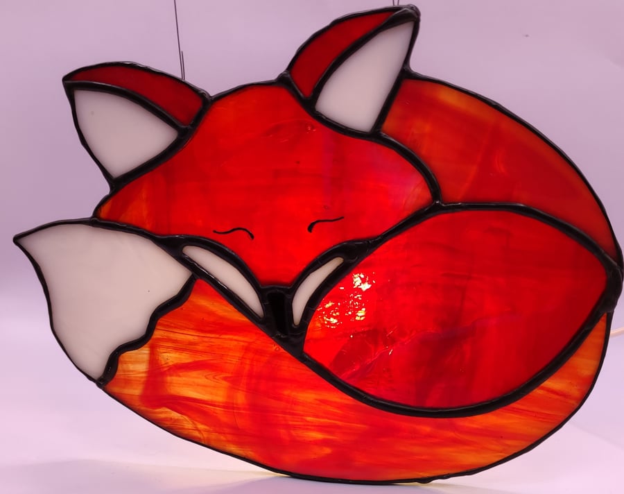 Hand made stained glass, sleepy red fox