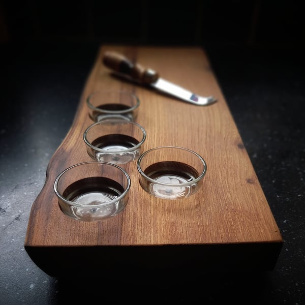 Elm cheeseboard with four tealight recesses, and glass cups.