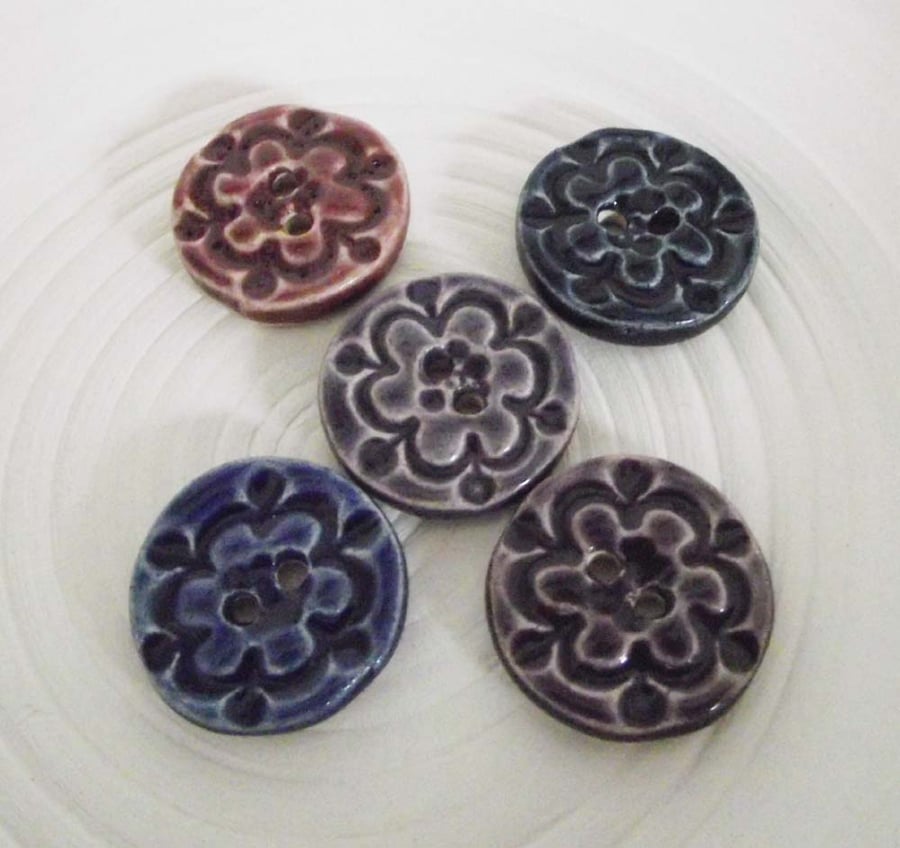 Set of five little handmade ceramic buttons in purples and blues
