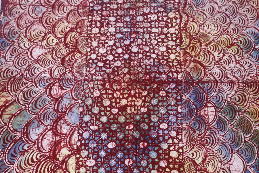 multicoloured crossed dots inspired hand printed African adire batik fabric 