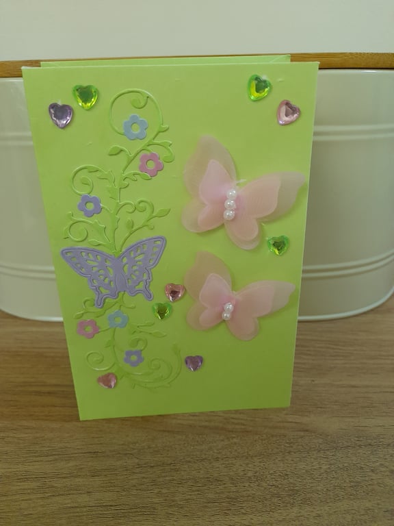 MULTI COLORED BUTTERFLY AND FLOWER CARD.