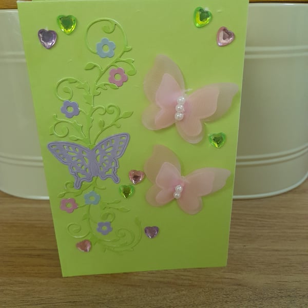 MULTI COLORED BUTTERFLY AND FLOWER CARD.