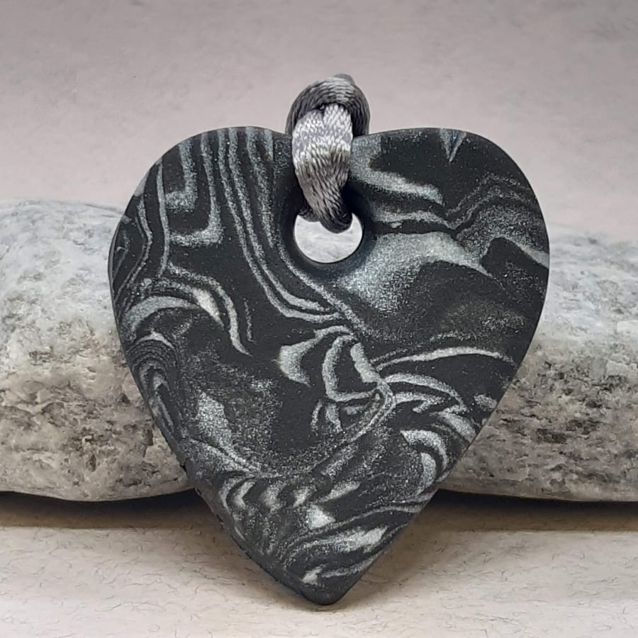 Black and silver heart shaped pendant