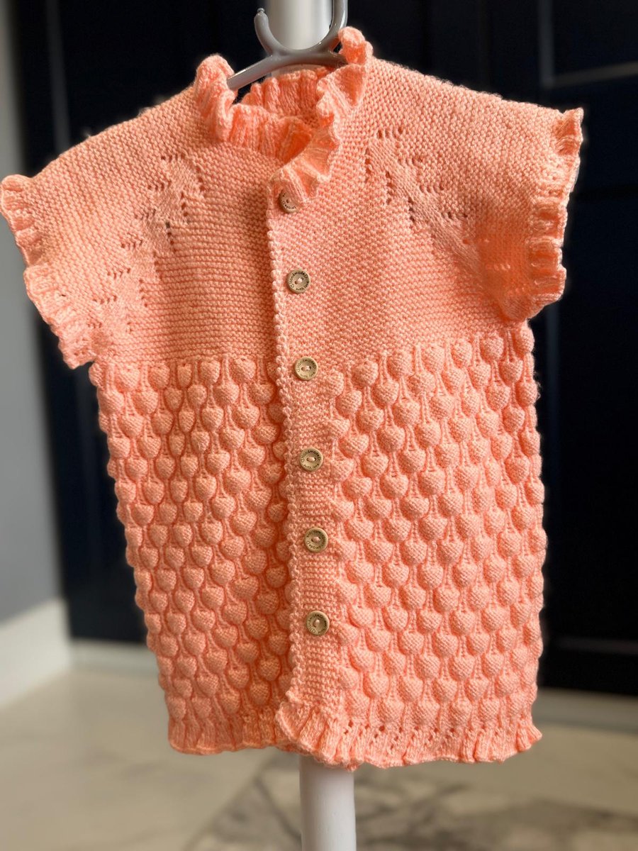 Hand-Knitted Ruffle Baby Vest with Popcorn Stitch – Soft Peach (18-24m)