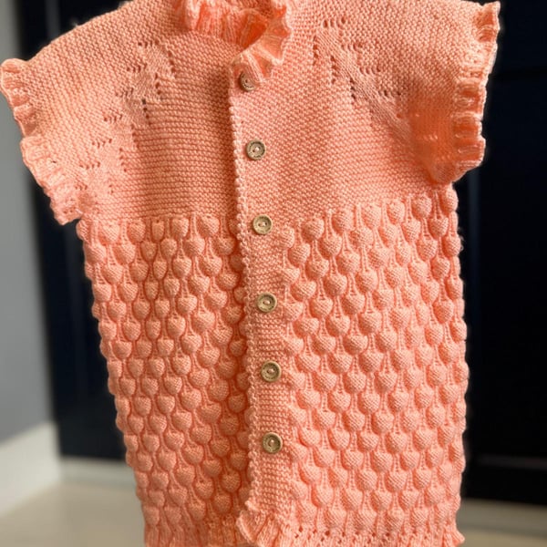 Hand-Knitted Ruffle Baby Vest with Popcorn Stitch – Soft Peach (18-24m)