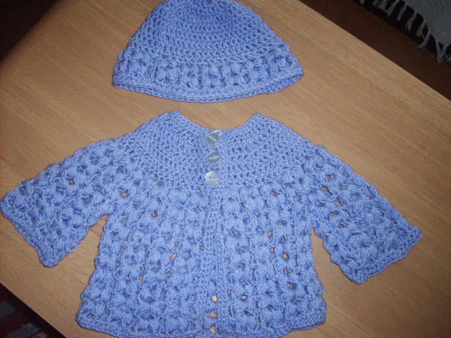 purple cardigan and bonnet