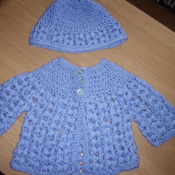purple cardigan and bonnet