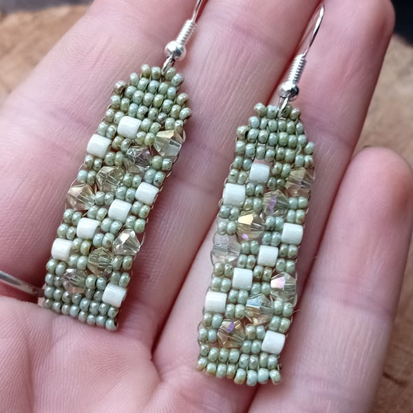 Sage green and cream glittering dangle earrings