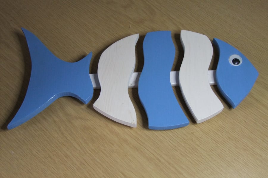 Fish shaped wooden trivet, blue & white in colour