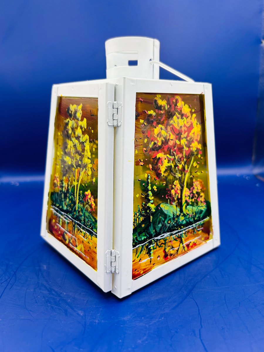 A hand painted and fired metal and glass lantern by Andrew Jenkins 
