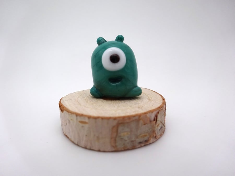 small green glass alien gift
