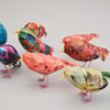 Teeny Tiny papier mâché birds in colourful plumage.