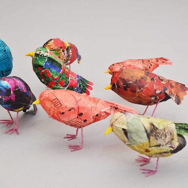 Teeny Tiny recycled papier mâché birds in colourful plumage.