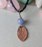 Copper leaf pendant with blue aventurine bead and macrame necklace