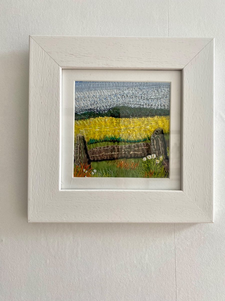 Yellow fields over the fence, embroidered landscape textile collage 