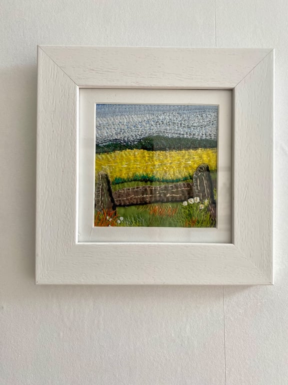 Yellow fields over the fence, embroidered landscape textile collage 