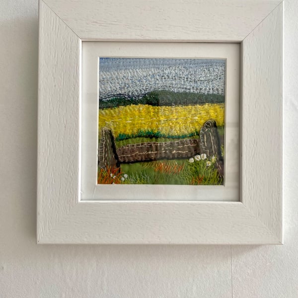 Yellow fields over the fence, embroidered landscape textile collage 