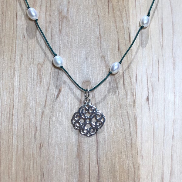 Silver pendant with freshwater pearls