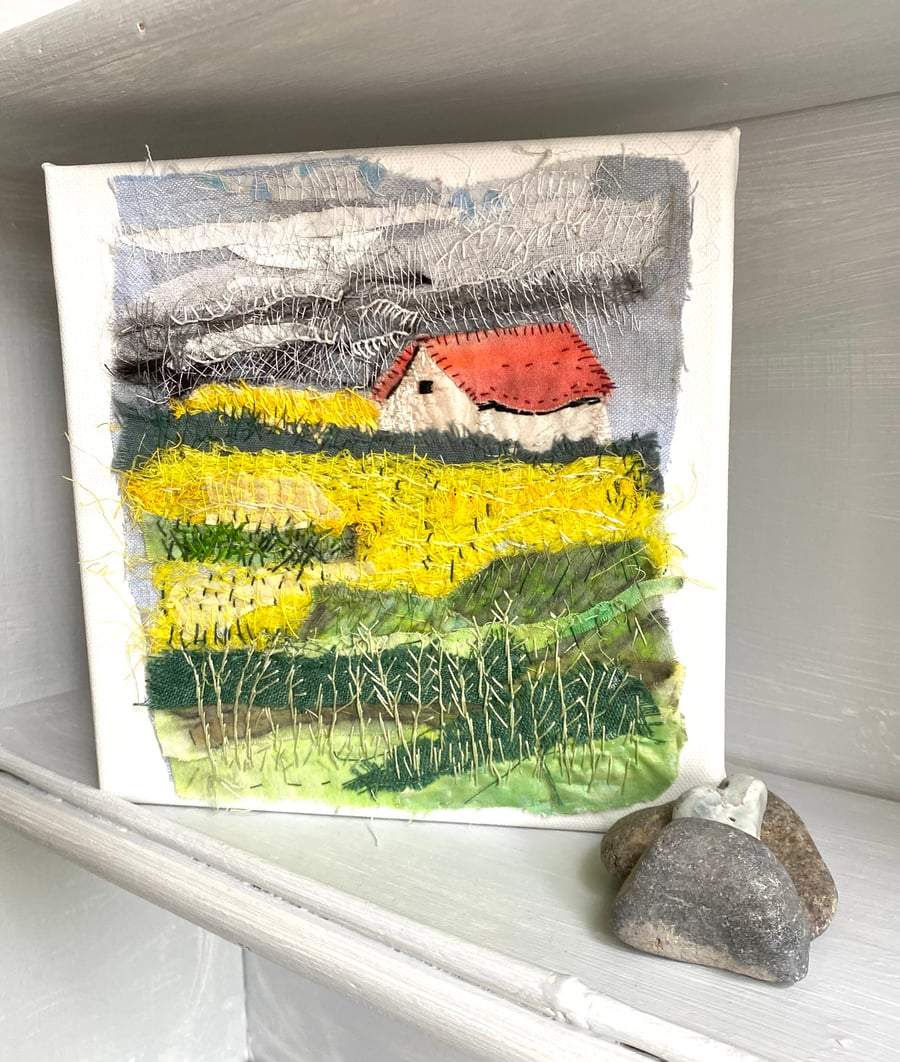 The cottage  across the fields-hand embroidered textile collage, on square canva