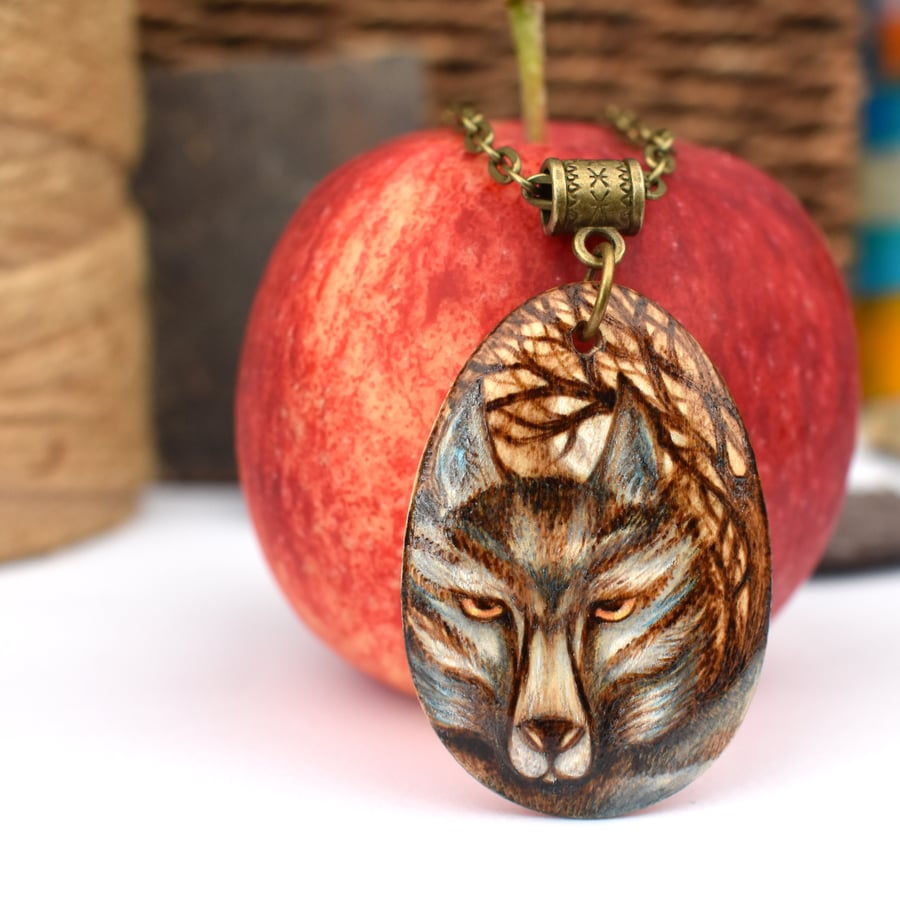 Moody wolf in the woods. Pyrography wooden pendant necklace.
