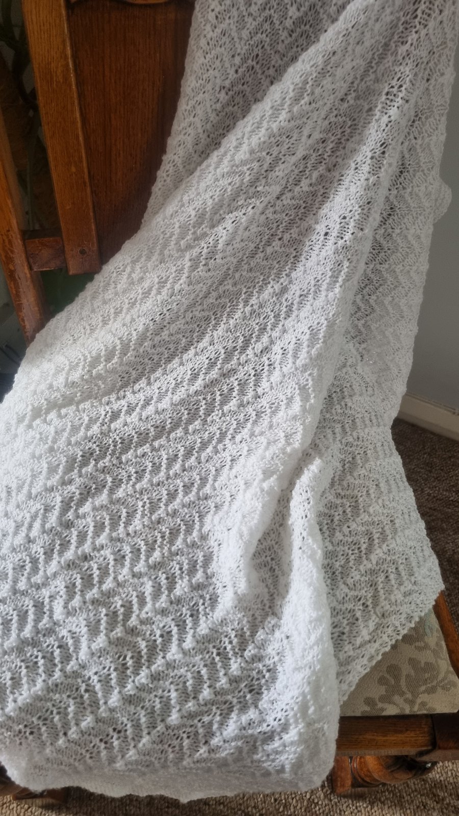 Handmade knitted white baby blanket, shawl