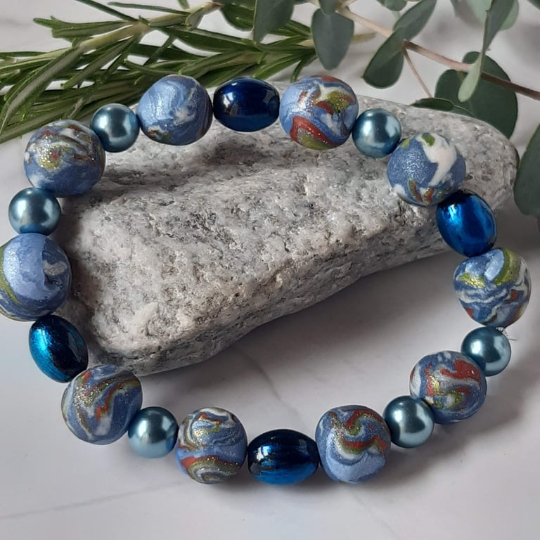 Handmade polymer clay bracelet in blue, lime green and sienna