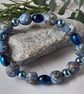 Handmade polymer clay bracelet in blue, lime green and sienna