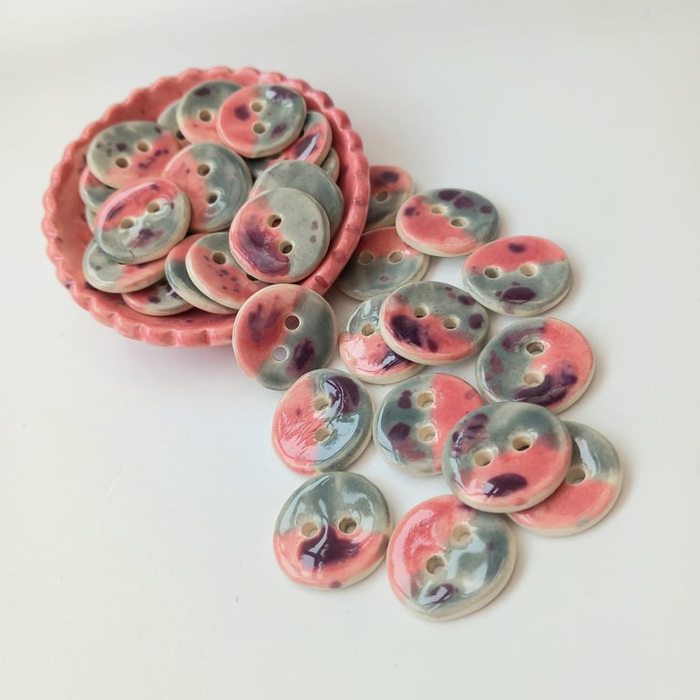 Half and half pink and grey buttons with a purple speckle finish. 20mm x 6.
