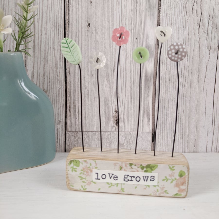 Button and Clay Flower Garden in a Floral Block 'love grows' 