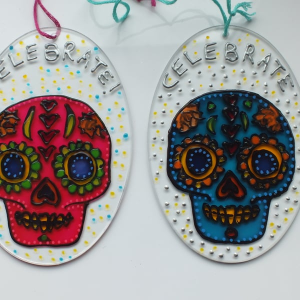 Day of the Dead sugar skull sun-catchers in turquoise and pink