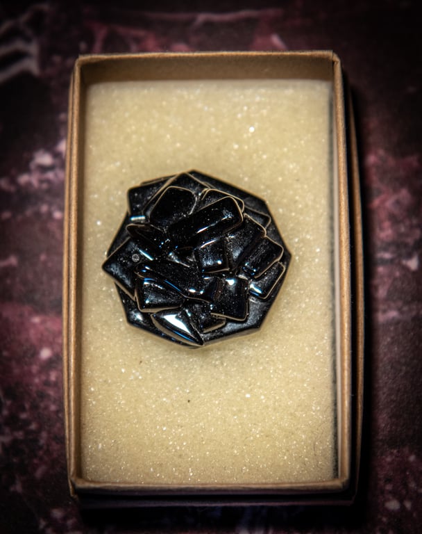 Unusual fused glass brooch in black. Complete with presentation box.